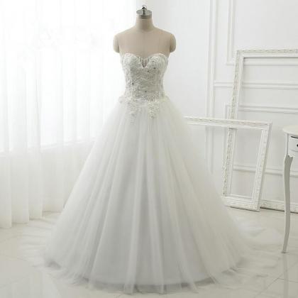 Floor Length A-line Tulle Wedding Gown Featuring..