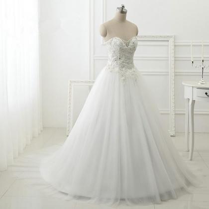 Floor Length A-line Tulle Wedding Gown Featuring..