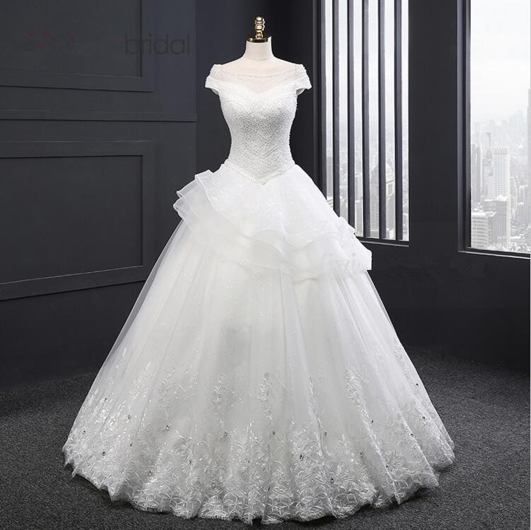 Off-the-shoulder A-line Peplum Wedding Dress With Beaded Sequin And Tulle Lace
